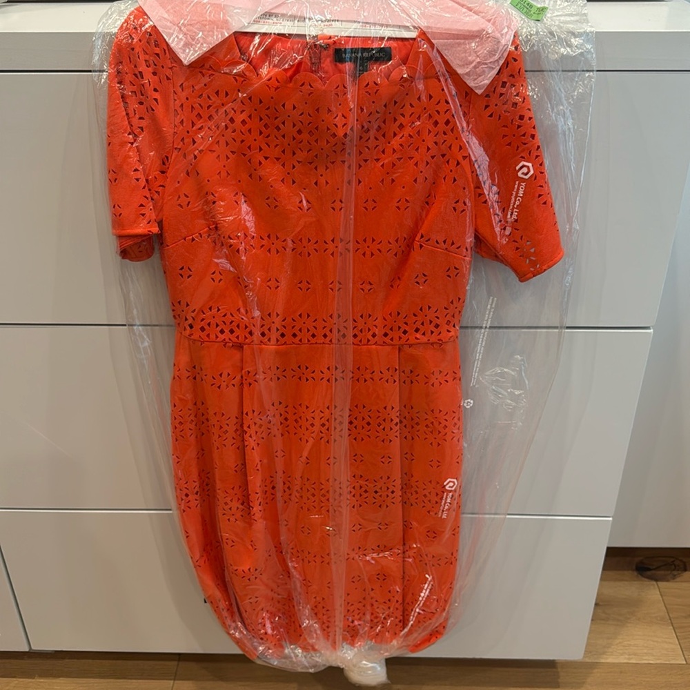 Banana Republic orange laser-cut sheath dress.